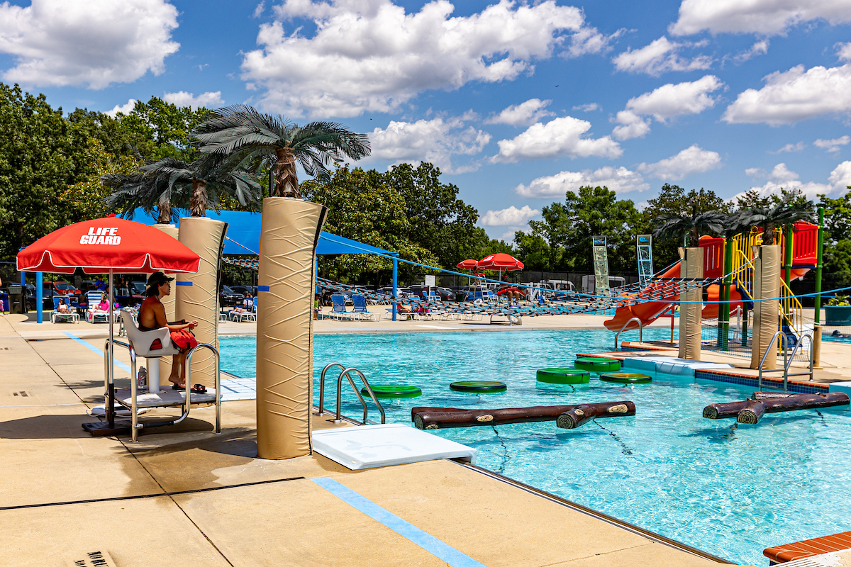 An outdoor splash park with climbing elements, waterslides, and more.